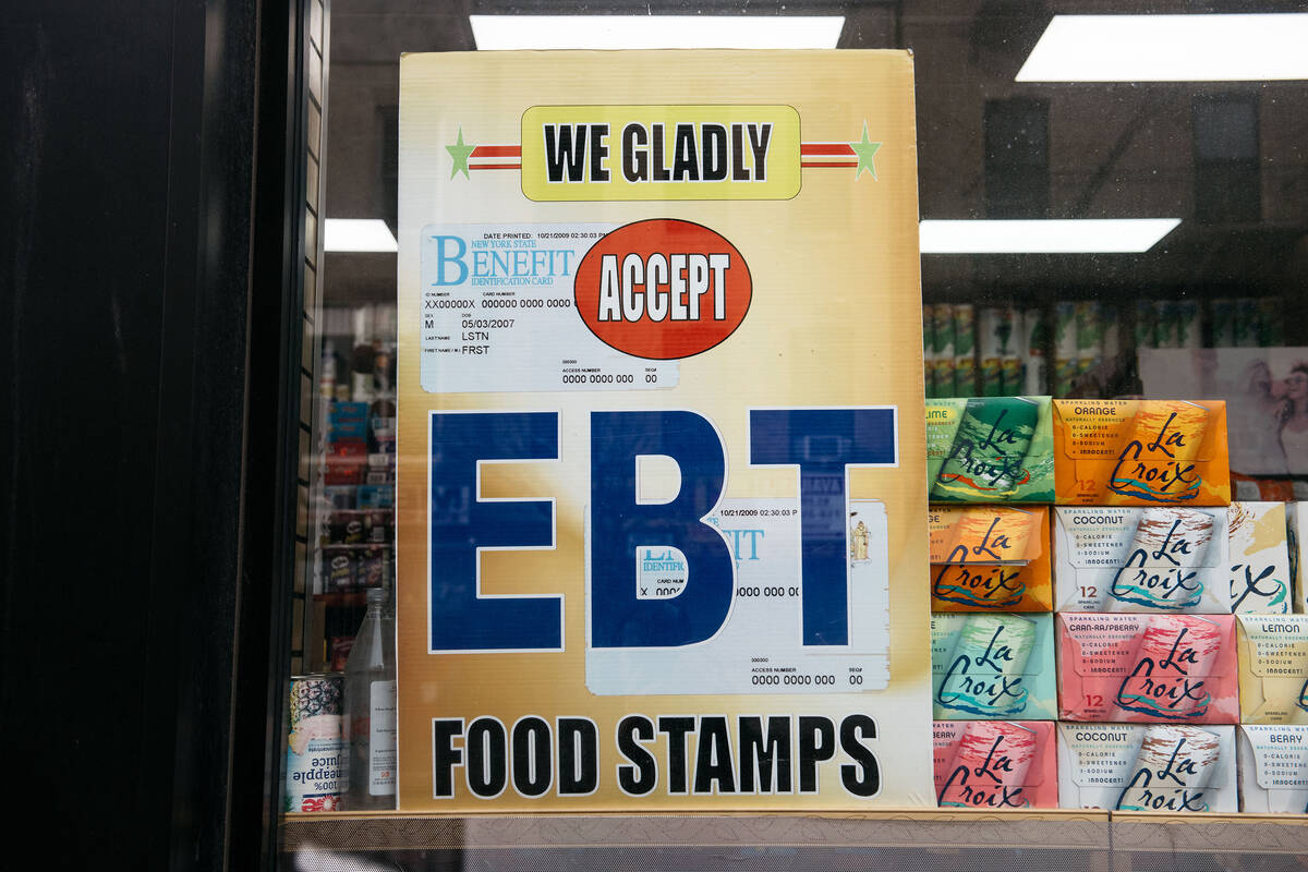 A sign alerting customers about SNAP food stamps benefits is displayed at a grocery store. (Sco ...