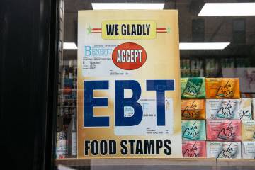 A sign alerting customers about SNAP food stamps benefits is displayed at a grocery store. (Sco ...