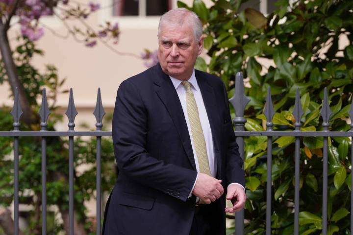 FILE - Prince Andrew looks round as he leaves after attending the Easter Matins Service at St. ...
