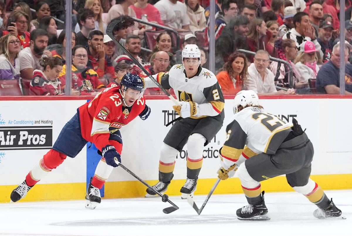 Florida Panthers center Carter Verhaeghe (23) vies with Vegas Golden Knights right wing Alexand ...
