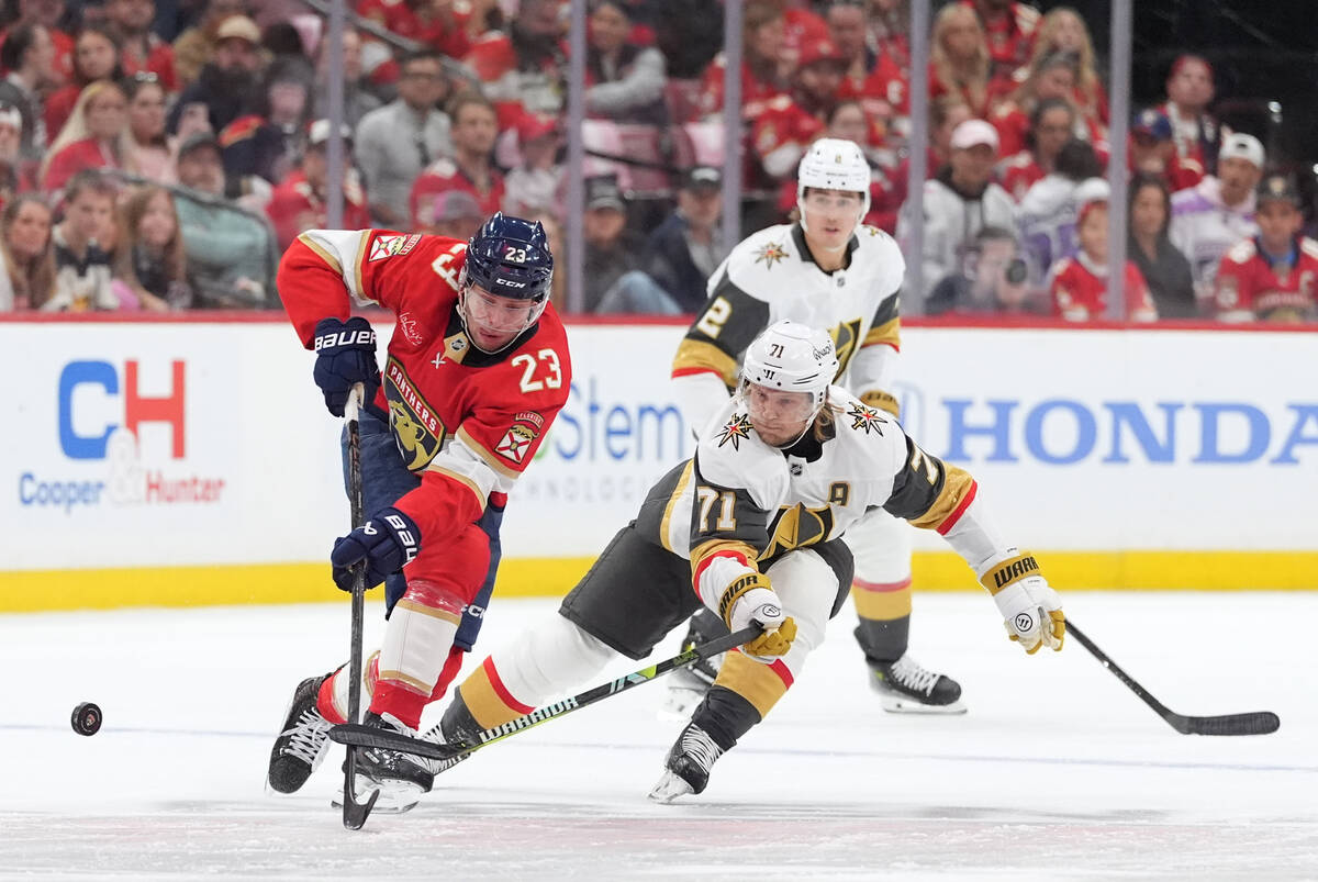 Florida Panthers center Carter Verhaeghe (23) vies with Vegas Golden Knights center William Kar ...