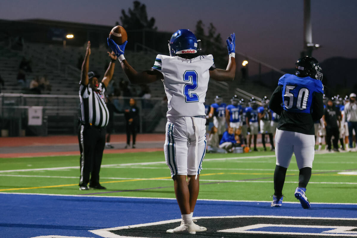 Green Valley wide receiver Evan Williams (2) celebrates making a touchdown after receiving a la ...