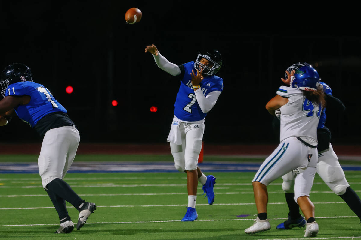Desert Pines quarterback Jerome Sequeira (2) makes a pass during the Class 5A Southern Region p ...