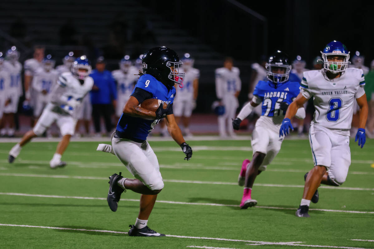 Desert Pines wide receiver Mario Velasco Fletcher (9) returns a kickoff during the Class 5A Sou ...