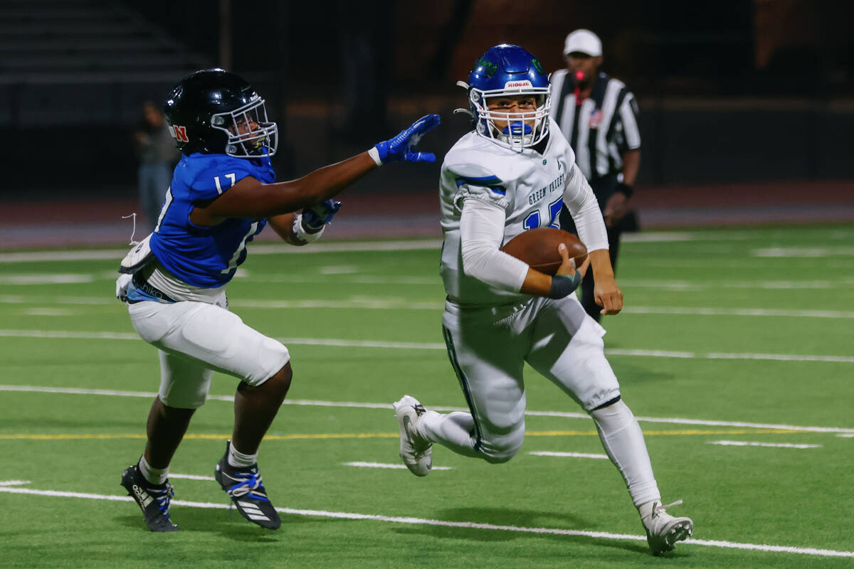 Desert Pines inside linebacker Ja'Mire Ross (17) pursues Green Valley quarterback Michael ...