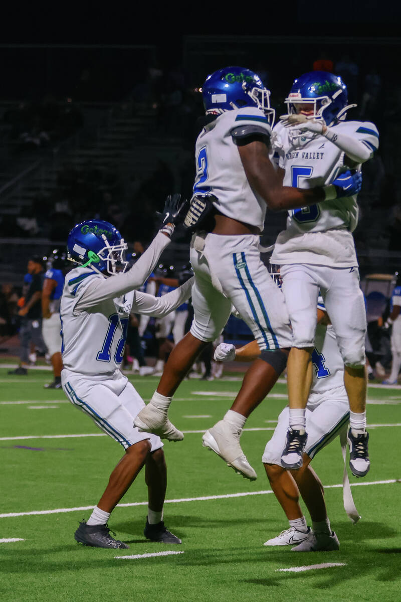 Green Valley players celebrate their as the clock runs out in the Class 5A Southern Region play ...