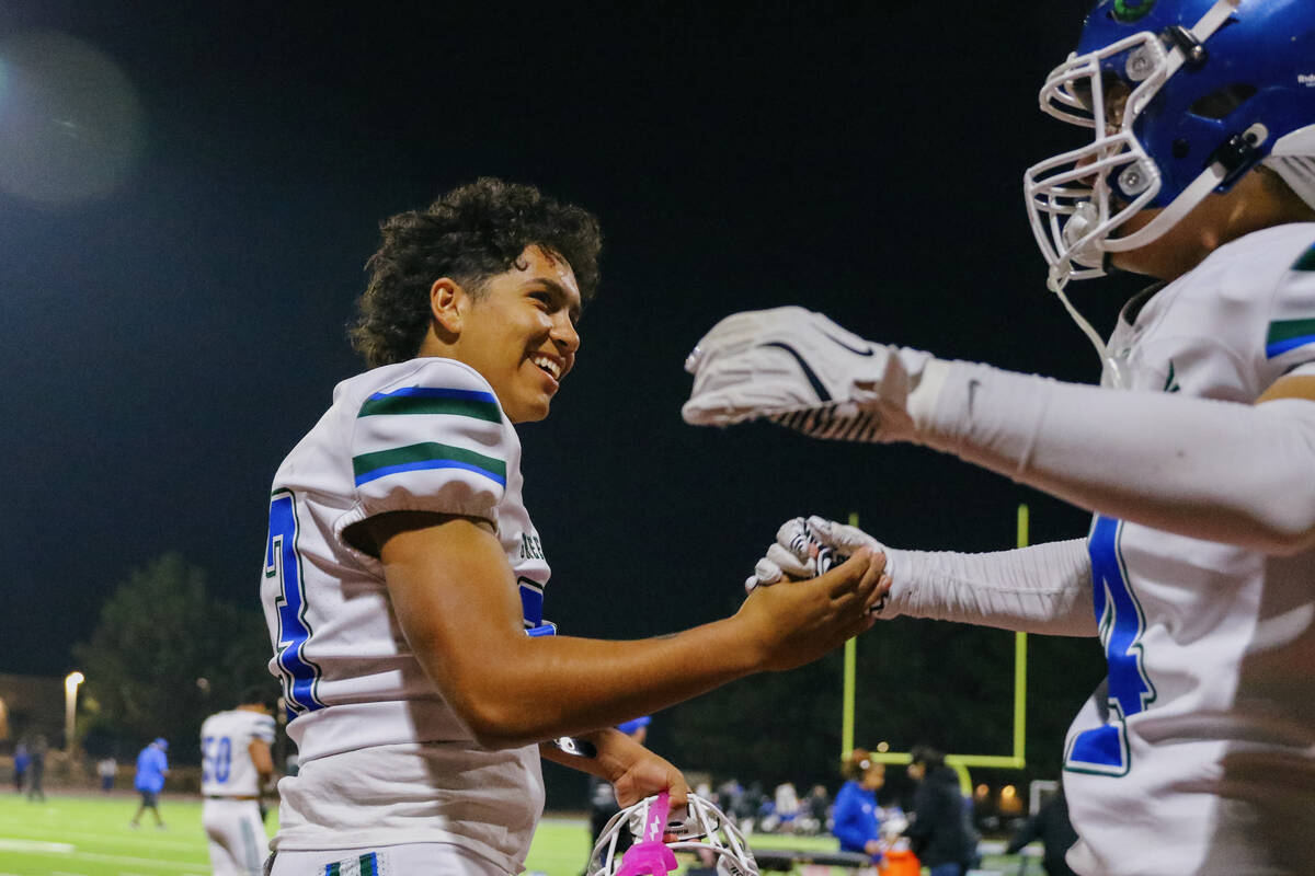 Green Valley players celebrate their win over Desert Pines in the Class 5A Southern Region play ...