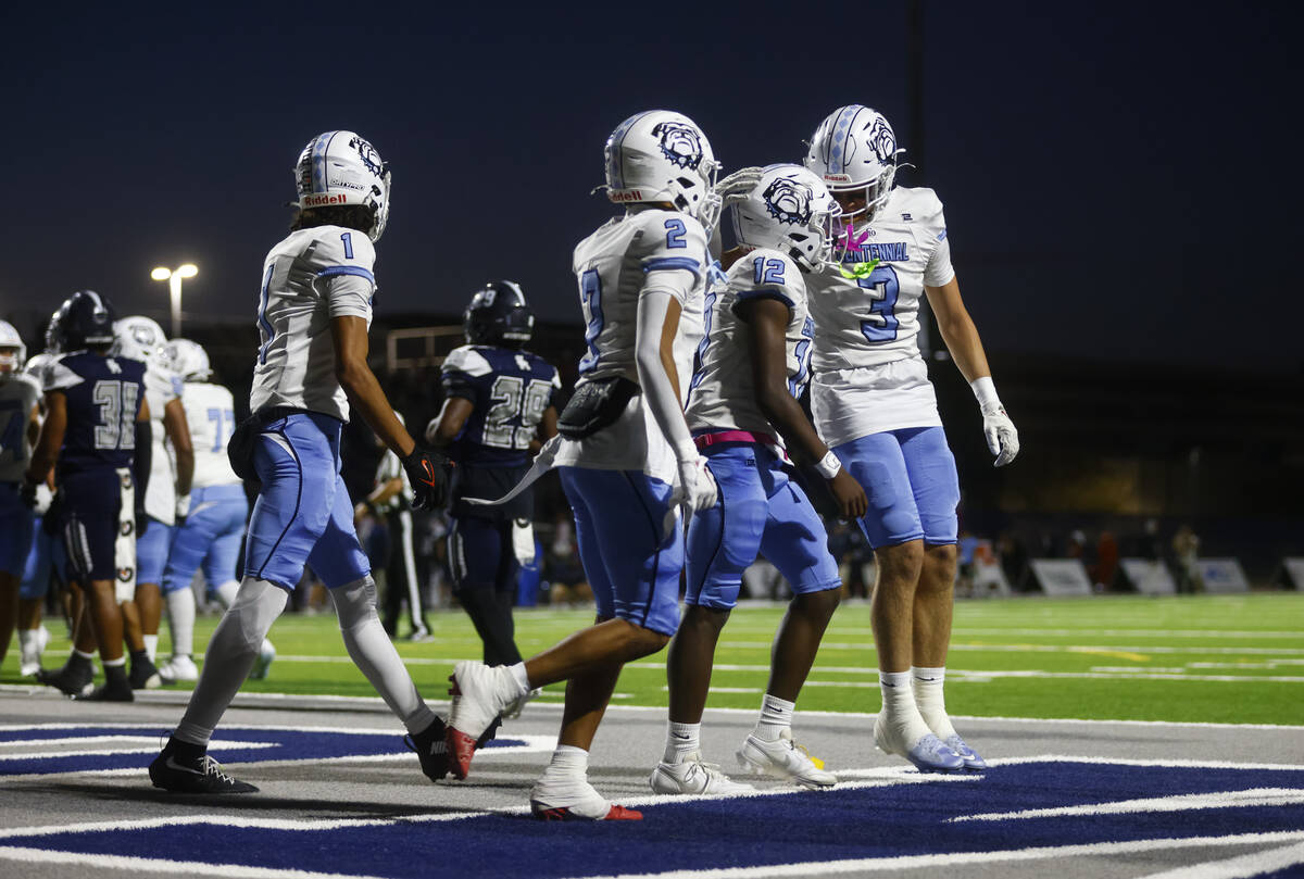 Centennial wide receiver/free safety Ethan Markos (3) celebrates the touchdown of Centennial q ...