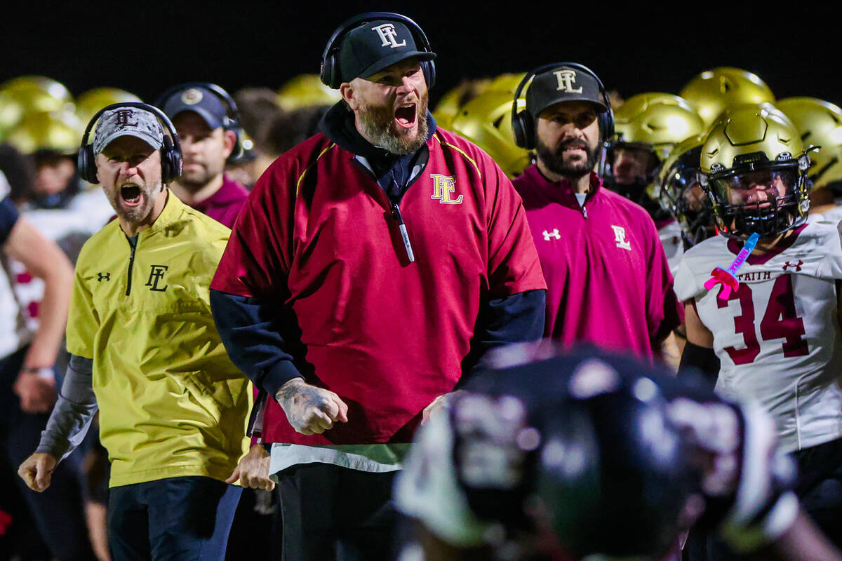 The Faith Lutheran coaching staff gets amped up during a class 5A Southern Region high school f ...