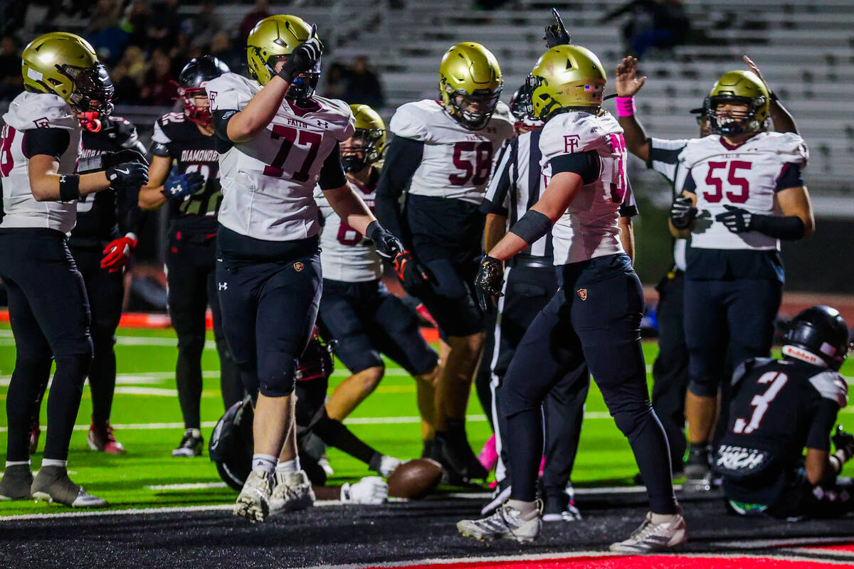 Faith Lutheran running back Justin Robbins (33) celebrates a touchdown during a class 5A South ...