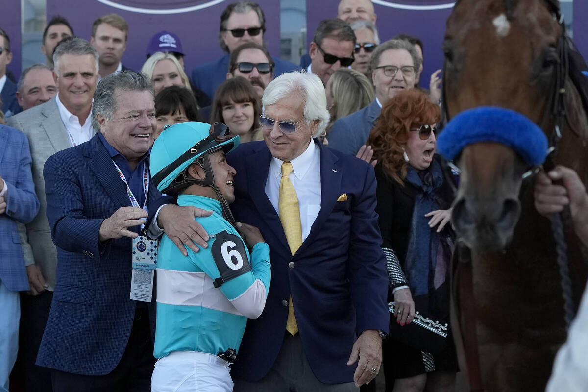 Martin Garcia (6) celebrates with horse trainer Bob Baffert, middle, after riding Citizen Bull ...