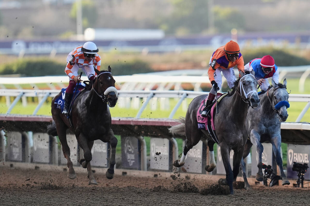 John Velazquez rides Ted Noffey, center, to victory past Flavien Prat, riding Brant, right, and ...