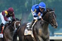 Jockey Junior Alvarado reacts aboard Sovereignty (2), as he crosses the finish line aboard Sove ...