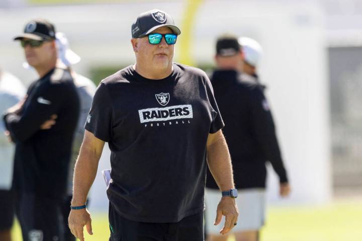 Raiders offensive coordinator Chip Kelly walks the field during the team’s practice at t ...