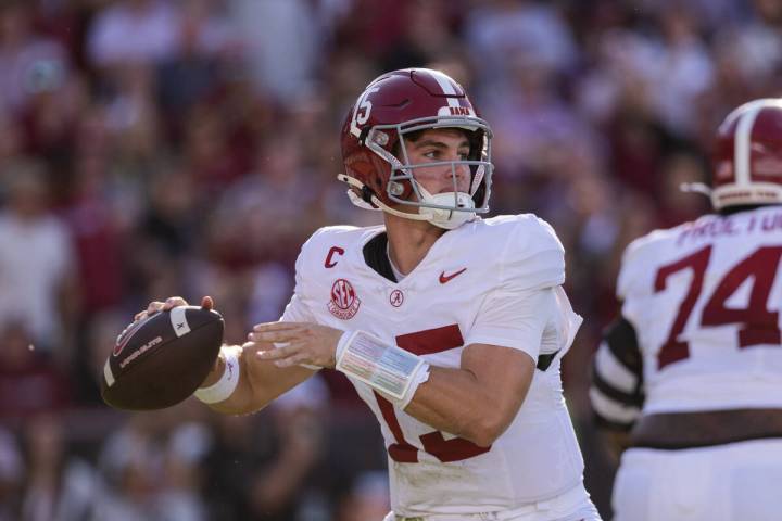 Alabama quarterback Ty Simpson (15) throws a pass during the first half of an NCAA college foot ...