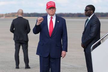 President Donald Trump gestures as he arrives on Air Force One, Thursday, Oct. 30, 2025, at Joi ...