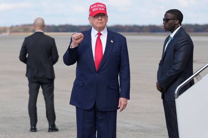 President Donald Trump gestures as he arrives on Air Force One, Thursday, Oct. 30, 2025, at Joi ...