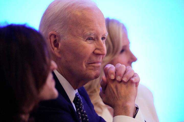 Former President Joe Biden listens to a speaker before receiving the Lifetime Achievement Award ...
