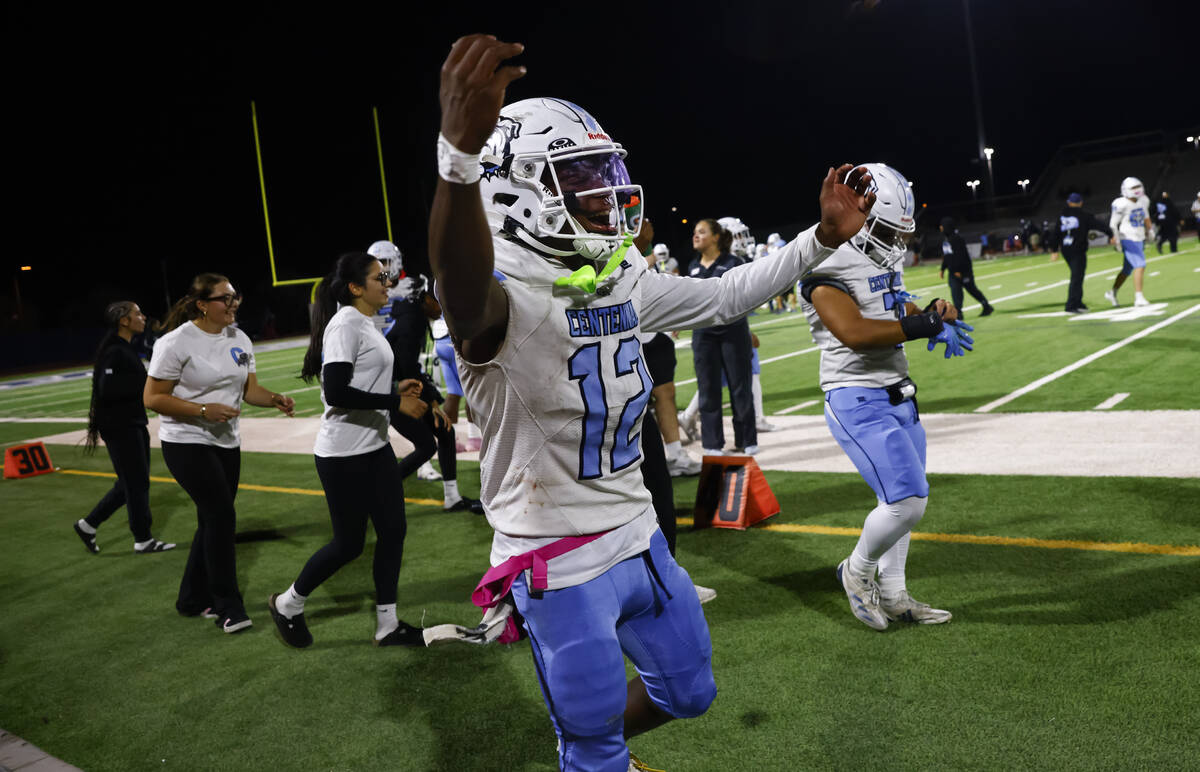 Centennial quarterback Nehemiah Dunlap Myvett (12) celebrates after defeating Shadow Ridge in ...