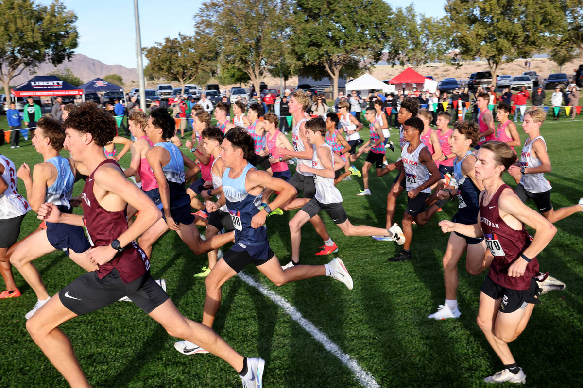 Runners sprint at the start of their race during the Nevada Interscholastic Activities Associat ...