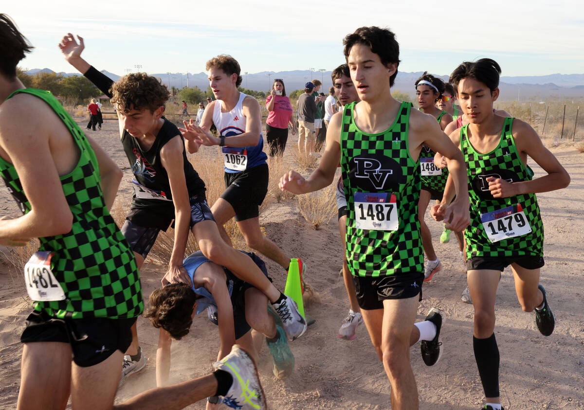 Centennial High School freshman Noah Brown (1102) tries to get up after falling during the Neva ...