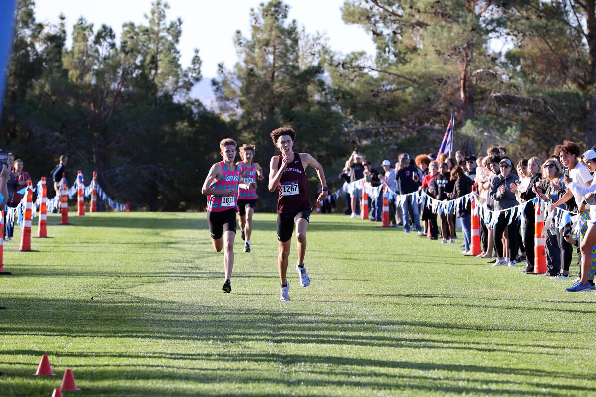 Faith Lutheran’s Brady Anderson (1267) runs ahead of Sky Pointe’s Carter Prater (1611) and ...
