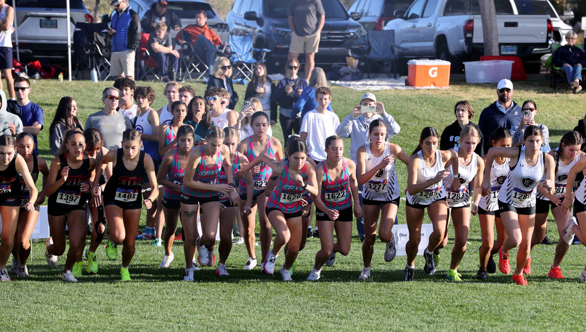 Runners sprint at the start of their race during the Nevada Interscholastic Activities Associat ...