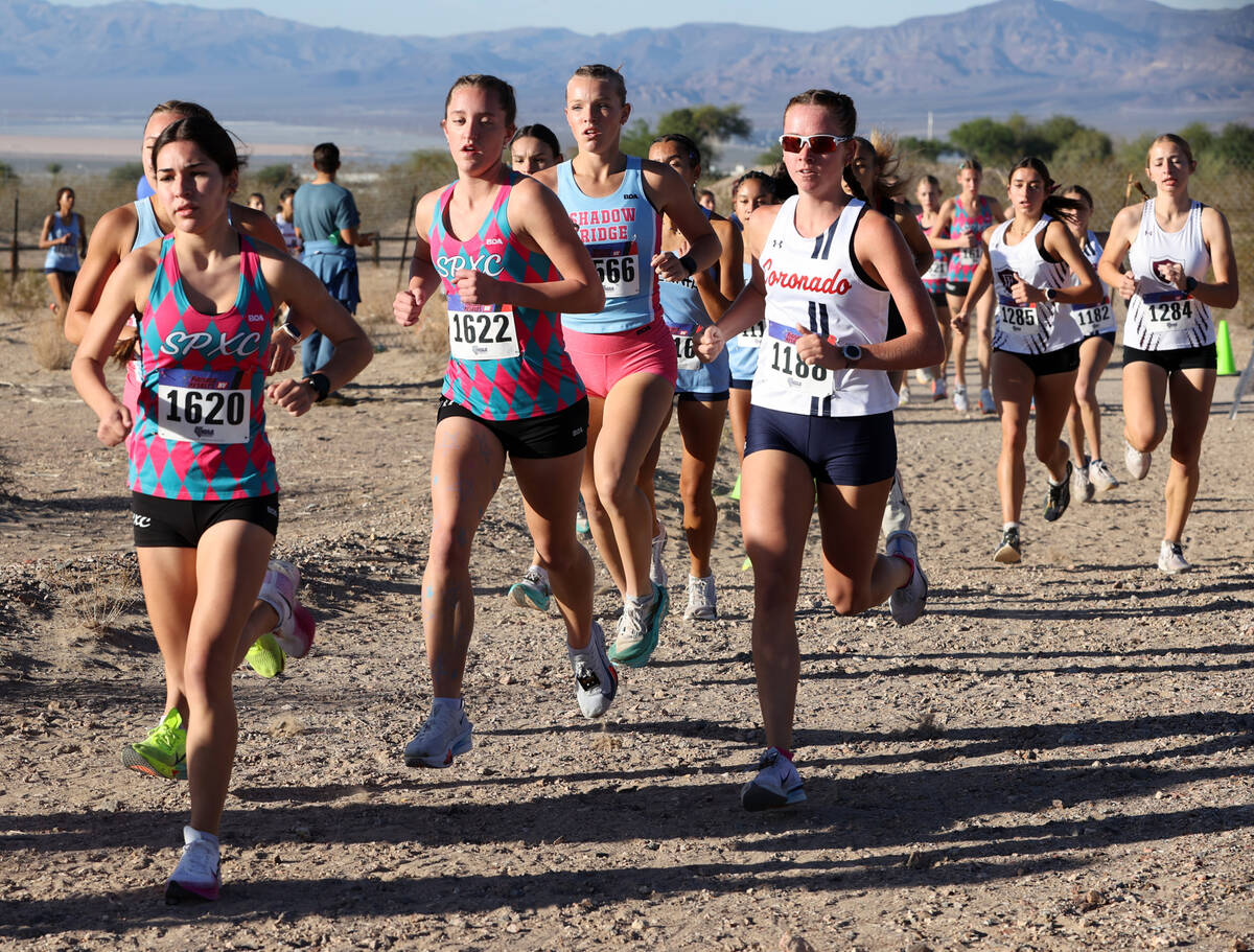 Runners make their way around the course during the Nevada Interscholastic Activities Associati ...
