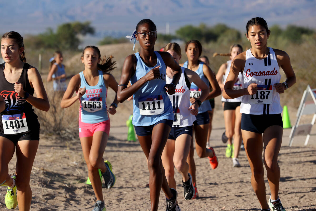 Runners make their way around the course during the Nevada Interscholastic Activities Associati ...