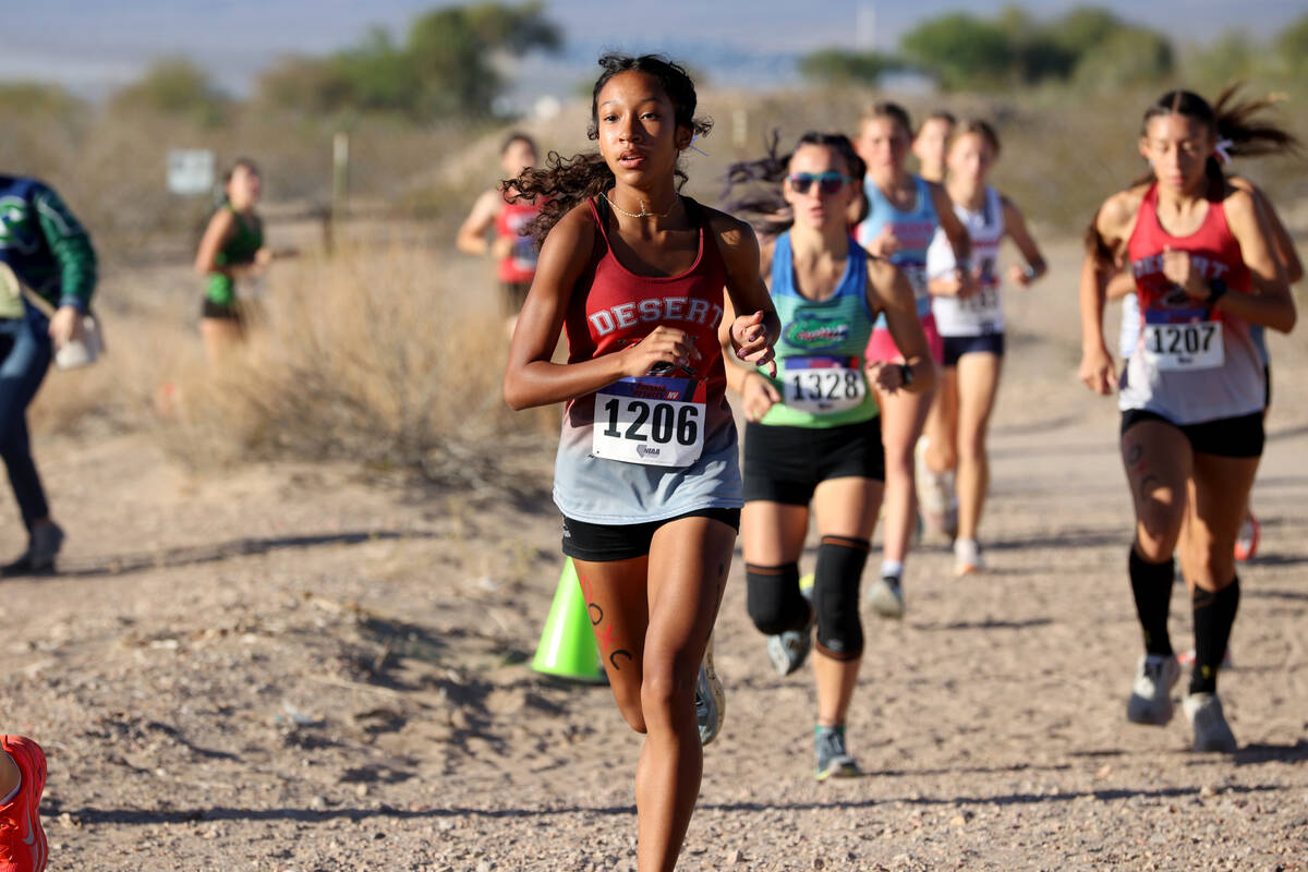 Runners make their way around the course during the Nevada Interscholastic Activities Associati ...