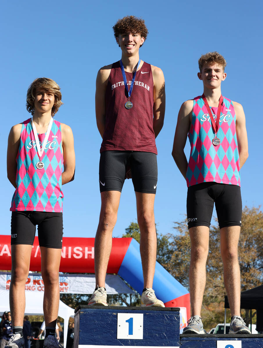 Faith Lutheran’s Brady Anderson, center, Sky Point’s Carter Prater, right, and Sa ...