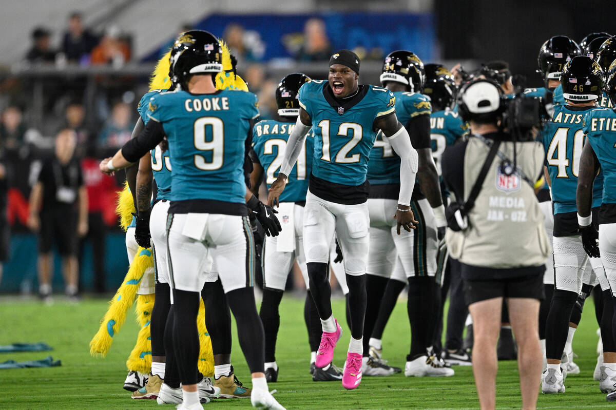 Jacksonville Jaguars wide receiver Travis Hunter (12) runs on the field during player introduct ...