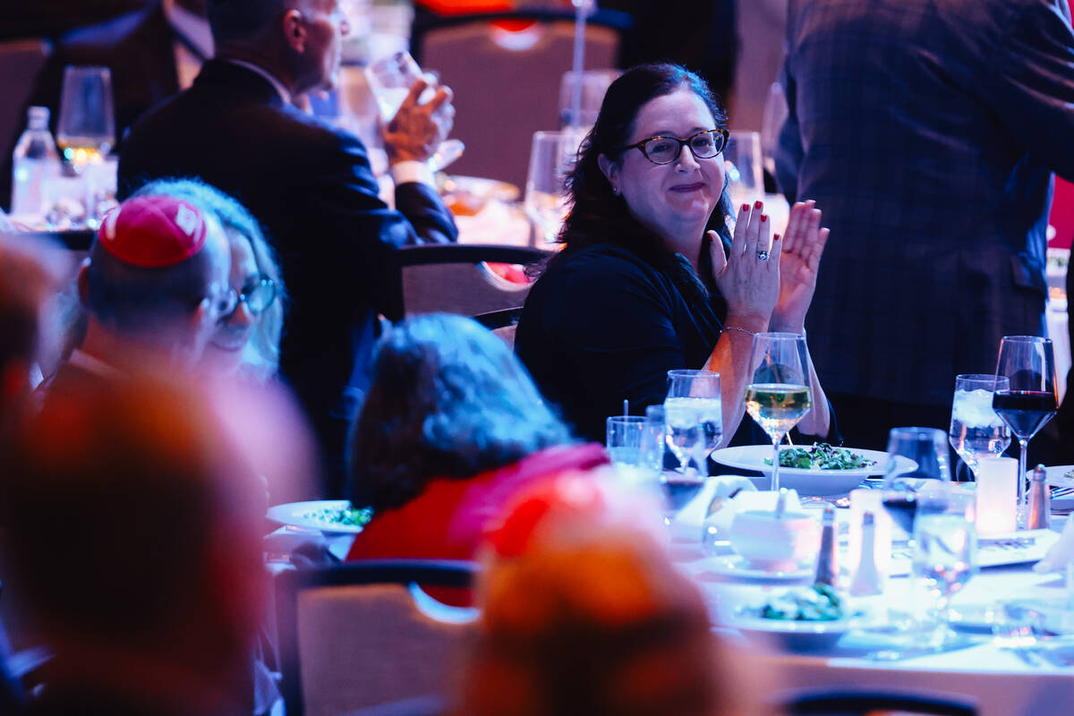 Attendees clap during a Republican Jewish Coalition dinner at the Venetian Friday, Oct. 31, 202 ...