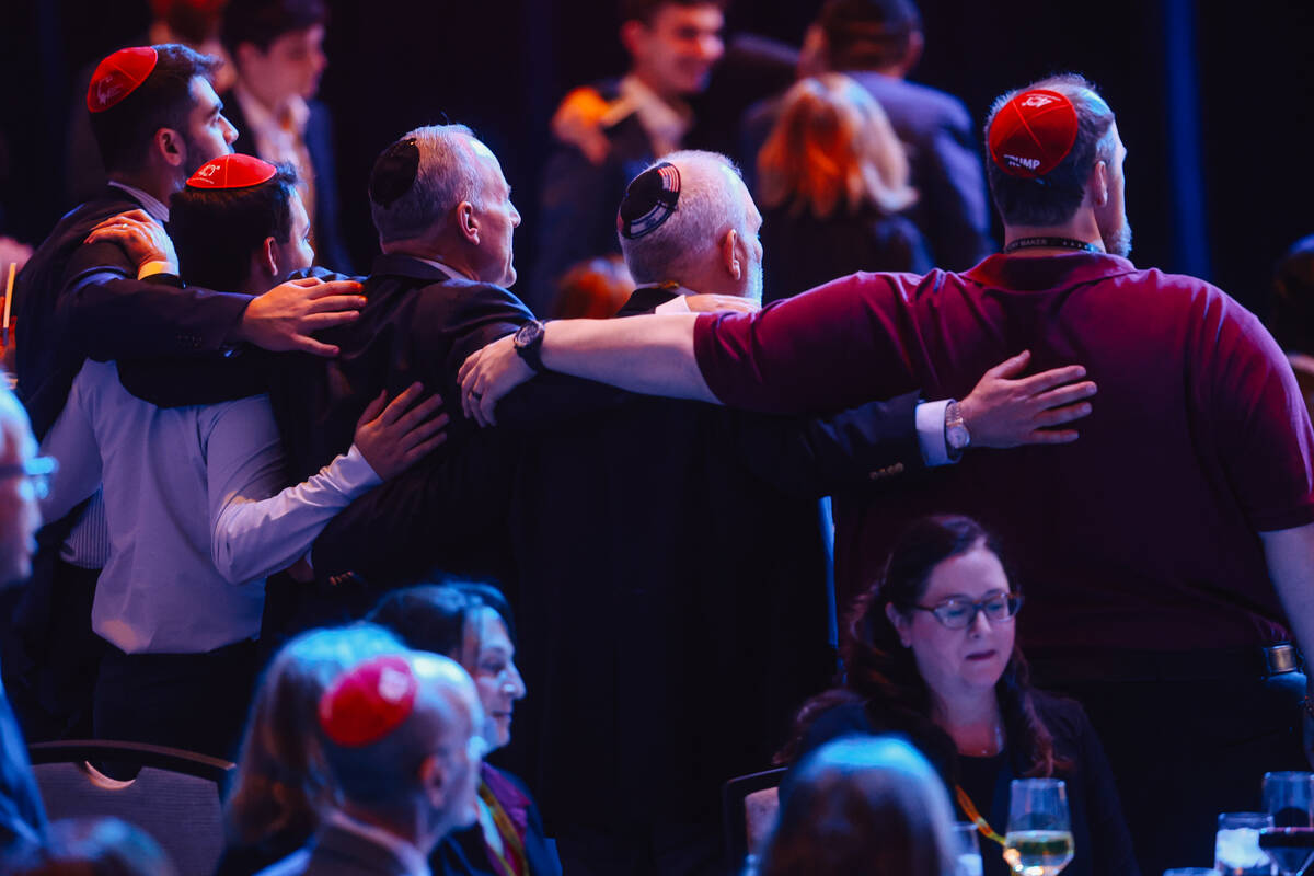 Attendees sing during a Republican Jewish Coalition dinner at the Venetian Friday, Oct. 31, 202 ...