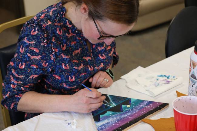 an employee at the Supervisor’s Office of the Humboldt-Toiyabe National Forest works on an or ...