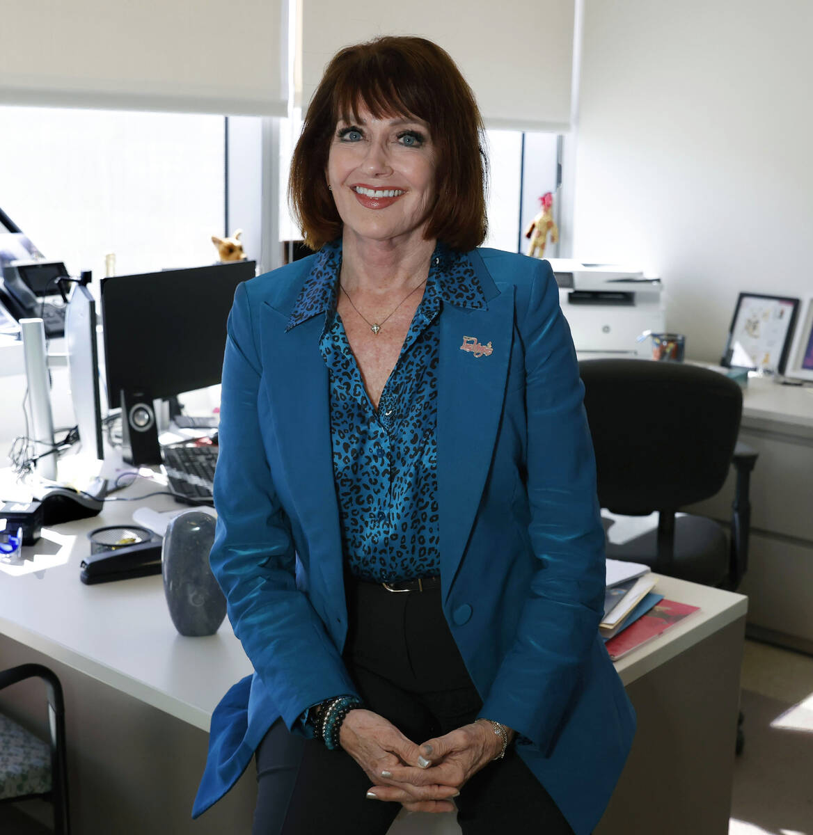 Sallie Doebler, CEO of the Mayor's Fund for Las Vegas LIFE, poses for a photo at her offic ...