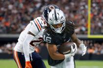 Raiders wide receiver Jakobi Meyers (16) protects the ball from Chicago Bears cornerback Nahsho ...