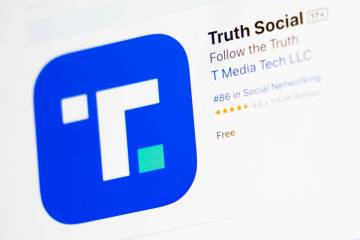 The download screen for Truth Social app is seen on a laptop computer, March 20, 2024, in New Y ...
