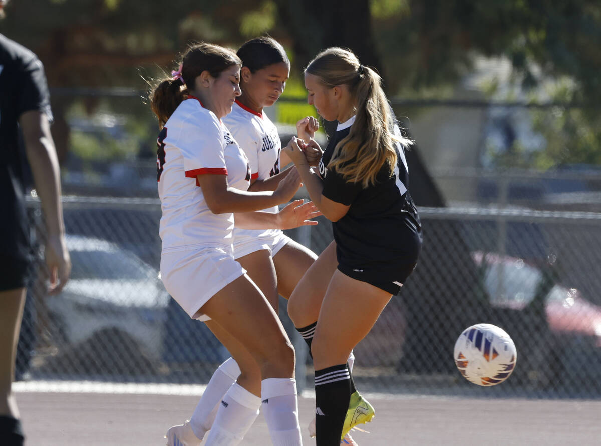 Palo Verde midfielder Brooke Bolinger, right, collides with Doral Academy forward Sienna Turco, ...