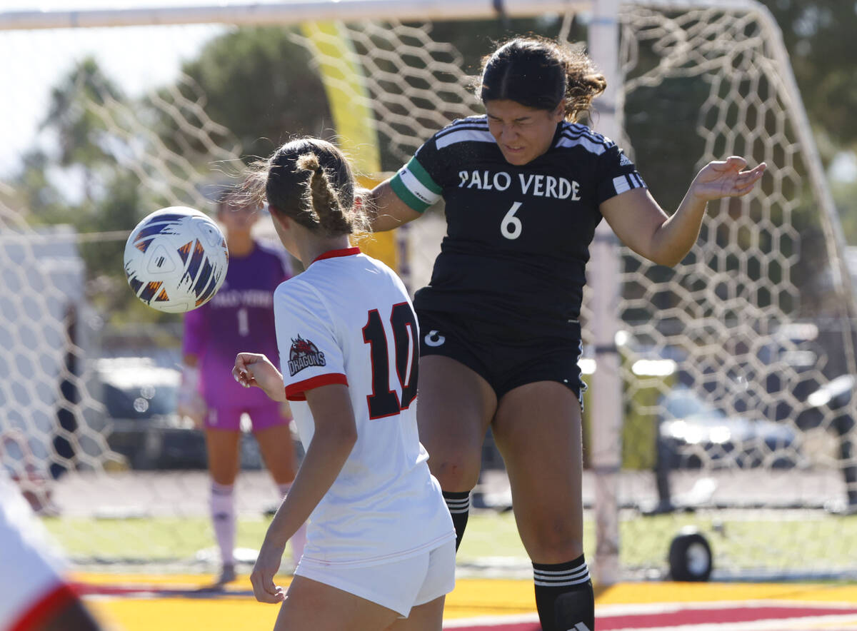 Palo Verde midfielder Leilani Palma (6) gore for a header as Doral Academy defense Chloe Mashor ...