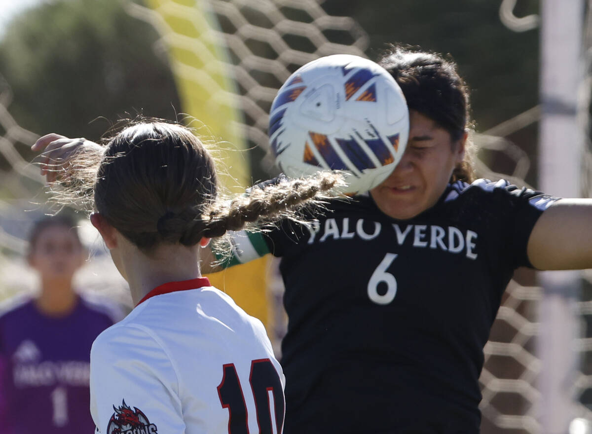 Palo Verde midfielder Leilani Palma (6) and Doral Academy defence Chloe Mashore (10) go for a h ...