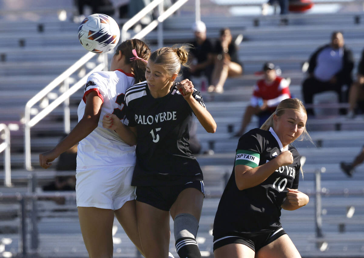 Doral Academy forward Sienna Turco, left, Palo Vede center Sadie Facer, center, and midfield Br ...