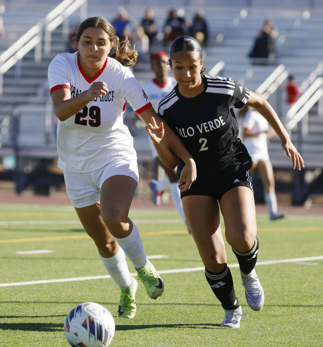 Doral Academy forward Sienna Turcos (29) and Palo Vede defense Jade Palma (2) fight for the bal ...