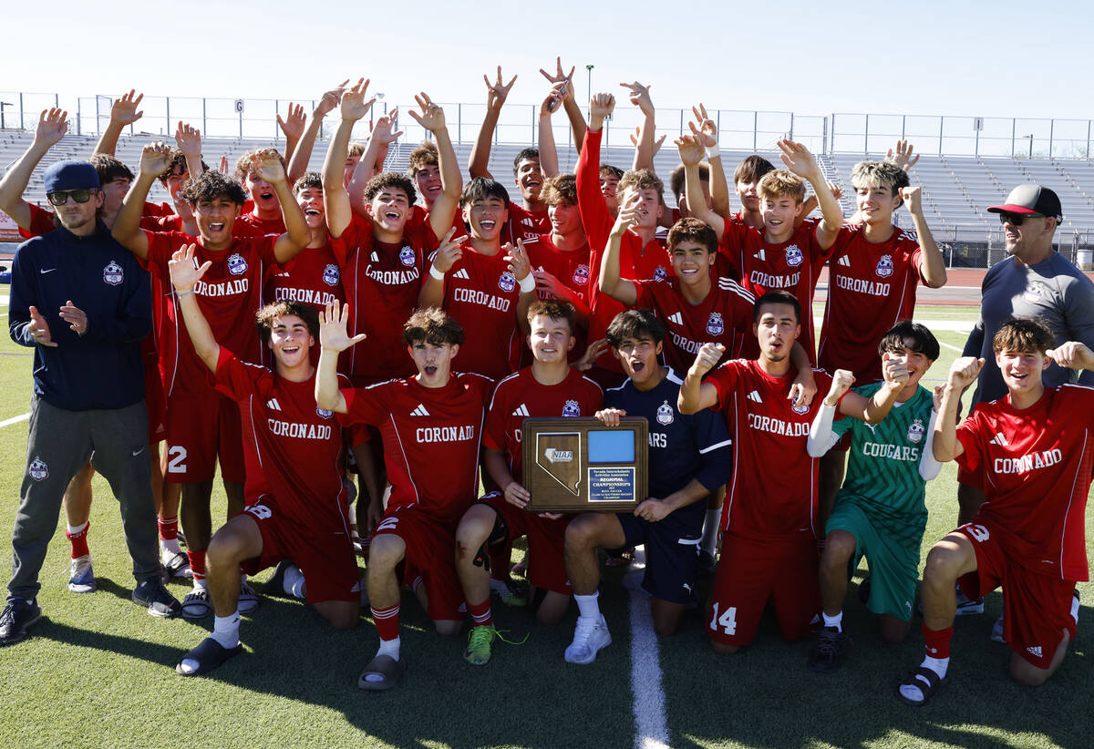 Coronado players celebrate their win in a Class 5A Southern Region boys soccer title game again ...