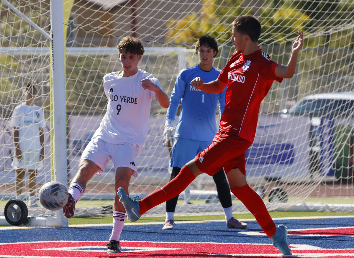 Palo Verde goalkeeper Jake Barrett (1) watches as defender Crew Simon (9) kicks the ball away f ...