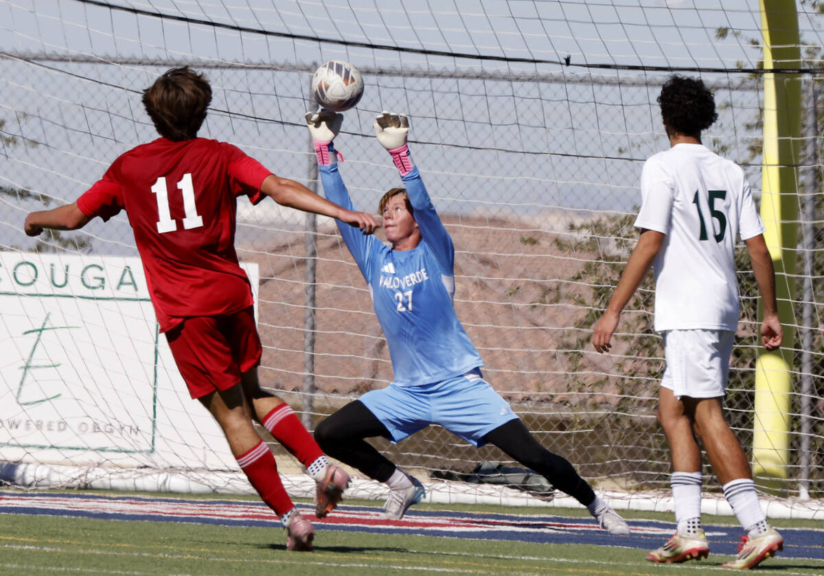Palo Verde goalkeeper Landon Blanchard (27) blocks Coronado striker Gavin Flickinger's (11 ...