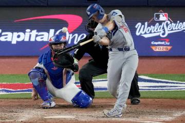 Los Angeles Dodgers' Will Smith connects for a home run against the Toronto Blue Jays duri ...