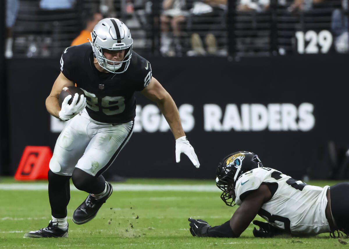 Raiders tight end Brock Bowers (89) runs the ball against the Jacksonville Jaguars during the s ...
