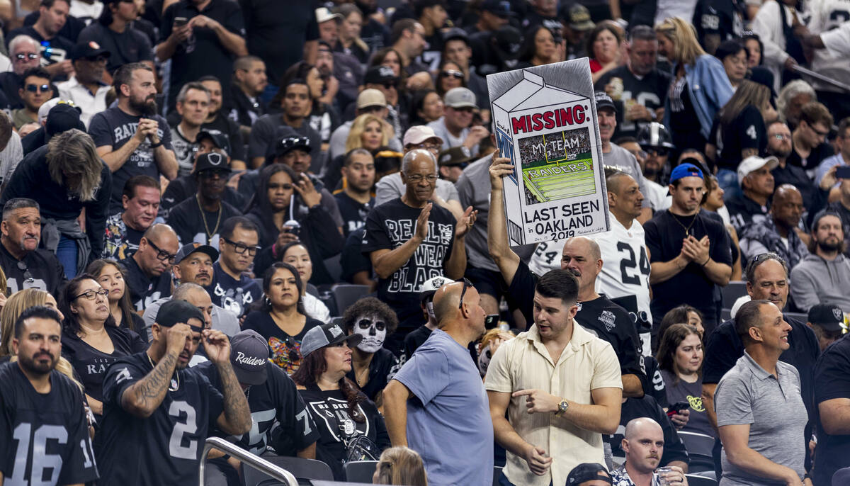 A raiders fan displays a milk carton sign against the Jacksonville Jaguars during the second ha ...