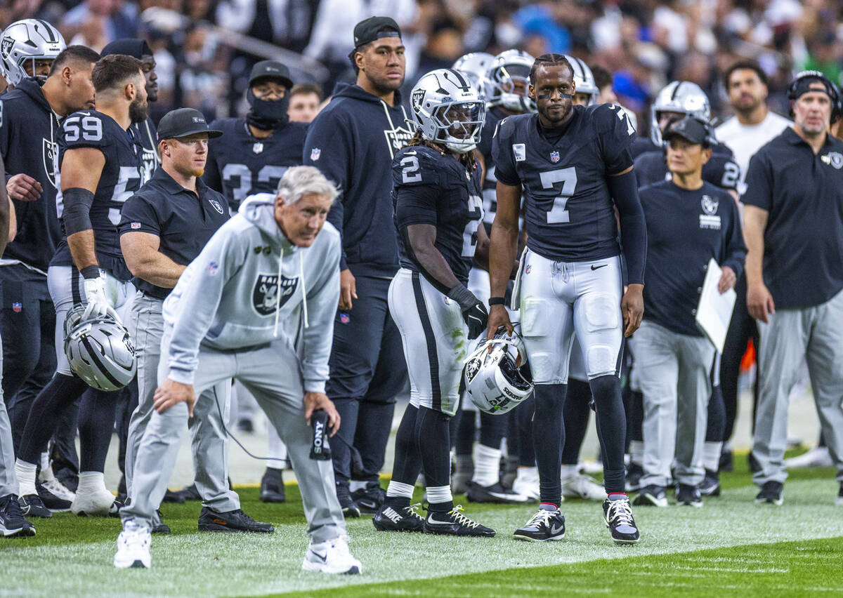 Raiders quarterback Geno Smith (7) and running back Ashton Jeanty (2) look on unhappily as the ...